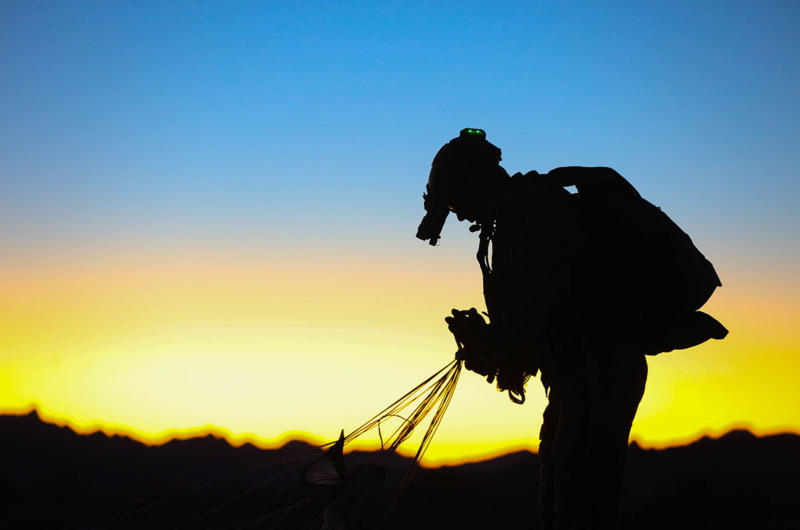 A silhouette images of a paratrooper after landing.