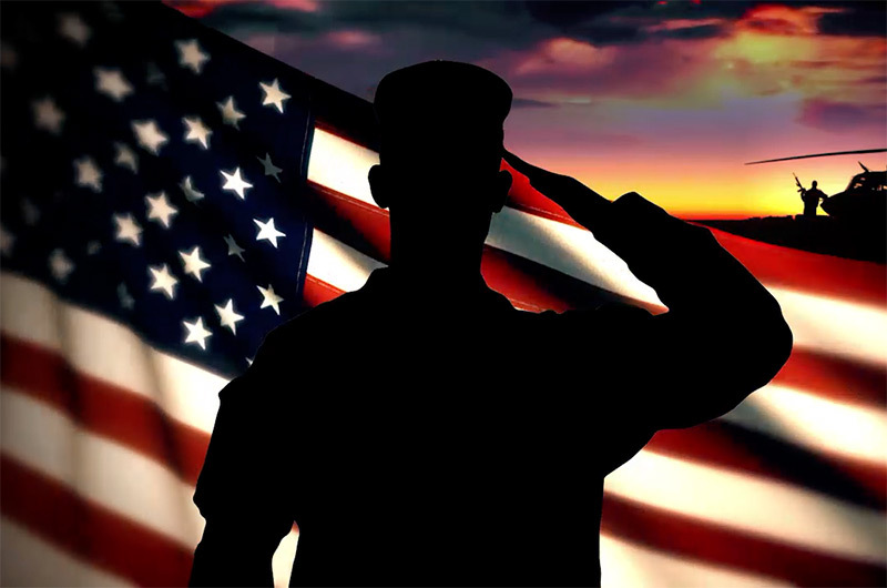 Soldier saluting flag